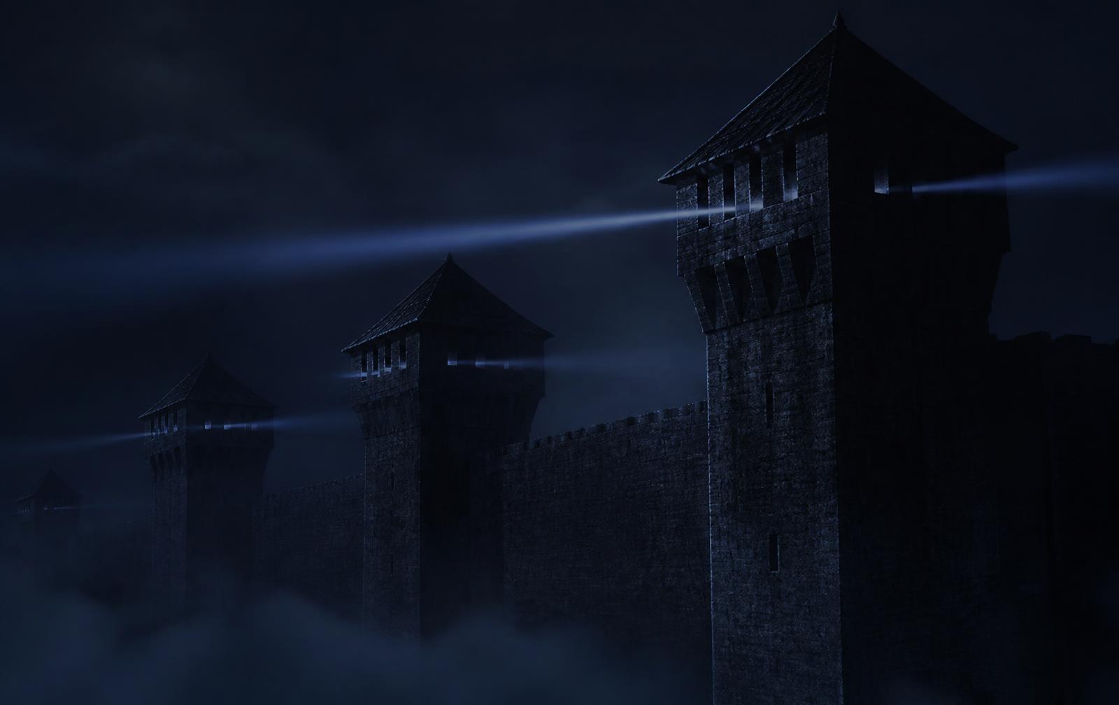 Stone watchtowers rising above a fortress wall, a slow beam of light sweeping across them